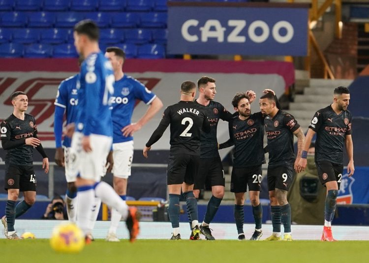 Manchester City's Bernardo Silva celebrates scoring their third goal with Gabriel Jesus and teammates at Goodison Park in Liverpool