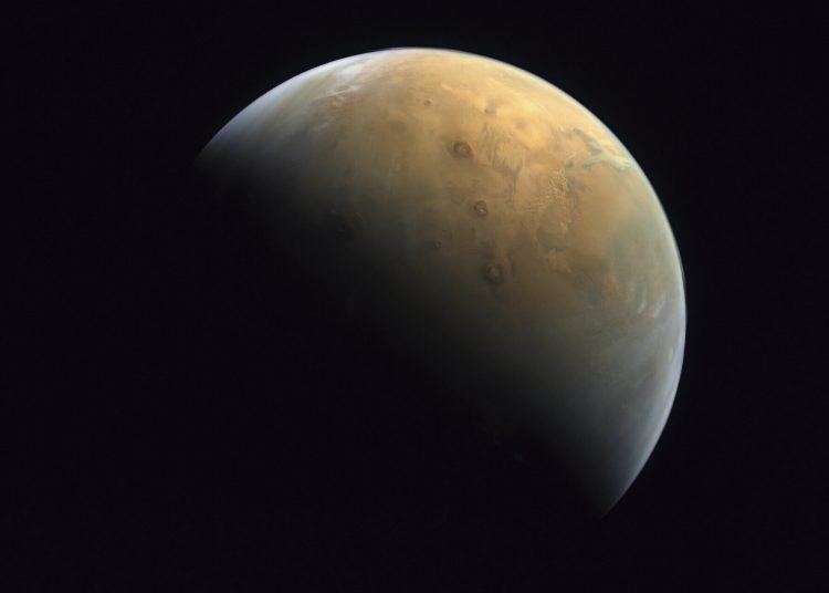 This Feb. 10, 2021 image taken by the United Arab Emirates' "Amal," or "Hope," probe was released Sunday, Feb. 14, 2021, shows Mars . The Hope space probe now circles the red planet. (Mohammed bin Rashid Space Center/UAE Space Agency, via AP)