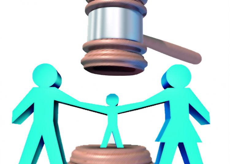 Child custody battle as a family law concept during a legal separation or divorce dispute as a father mother icon holding a child with a judge gavel or mallet coming down as a justice symbol for parenting rights.