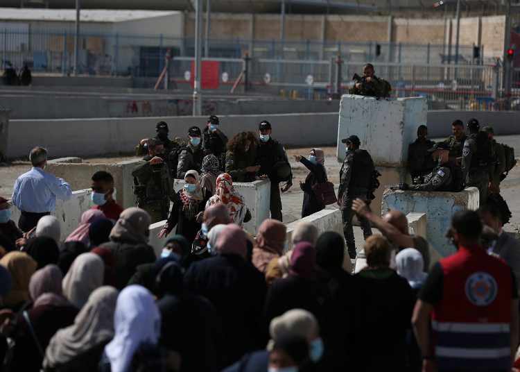 Israeli occupation forces at Qalandia checkpoint, at Ramallah-Jerusalem road, deny access of Palestinian worshipers from the occupied West Bank into Jerusalem.  WAFA Image