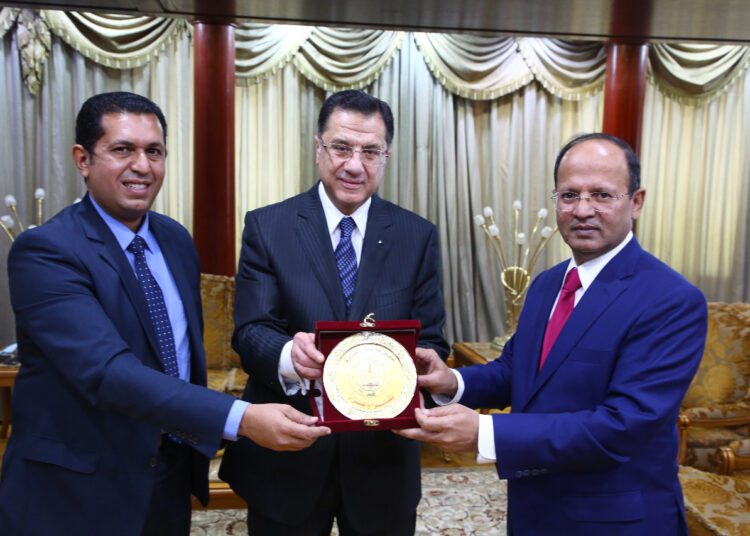 Tahrir Publishing House Board Chairman Eyad Abu Haggag (C) and Editor-in-chief of The Egyptian Gazette Mohamed Fahmy (L) handing Pakistani Ambassador in Cairo Sajid Bilal the medal of al-Tahrir Publishing House