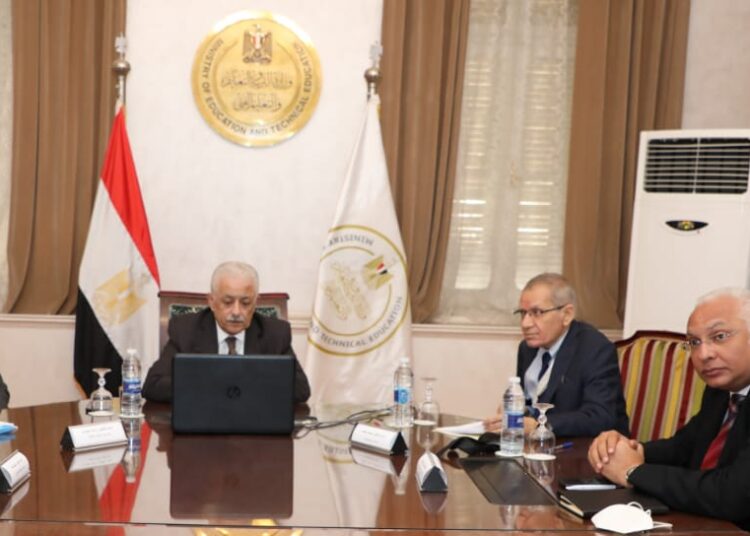 Egyptian Minister of Education and Technical Education Tarek Shawqi (c) during the video conferencing meeting