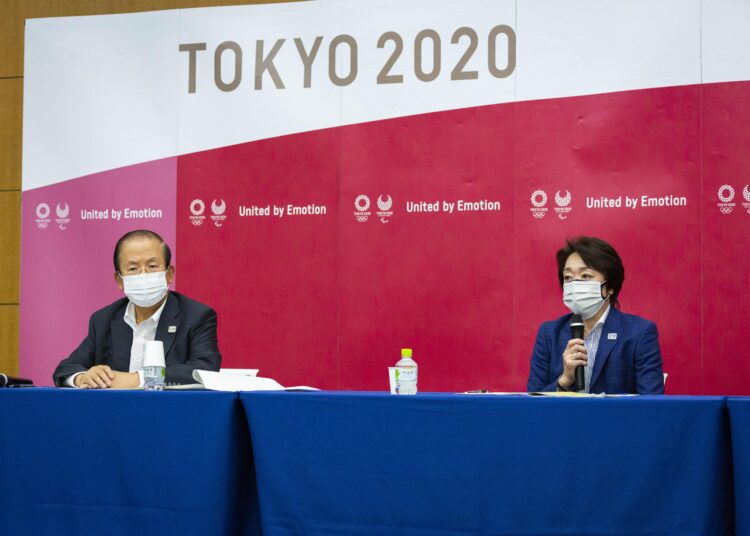 Tokyo scraps Olympics public viewing sites 1 - Egyptian Gazette Tokyo 2020 CEO Toshiro Muto, left, and President Seiko Hashimoto attend the news conference after receiving a report from a group of infectious disease experts on June 18, 2021, in Tokyo.
