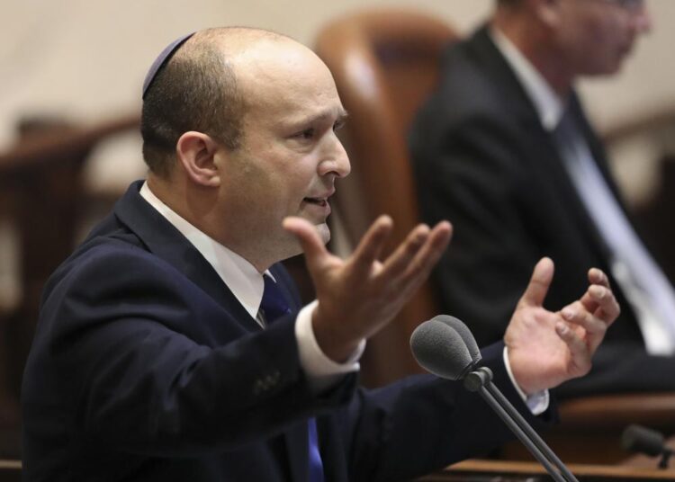 Israel's designated new prime minister, Naftali Bennett speaks during a Knesset session in Jerusalem Sunday, June 13, 2021. Bennett is expected later Sunday to be sworn in as the country's new prime minister, ending Prime Minister Benjamin Netanyahu's 12-year rule.