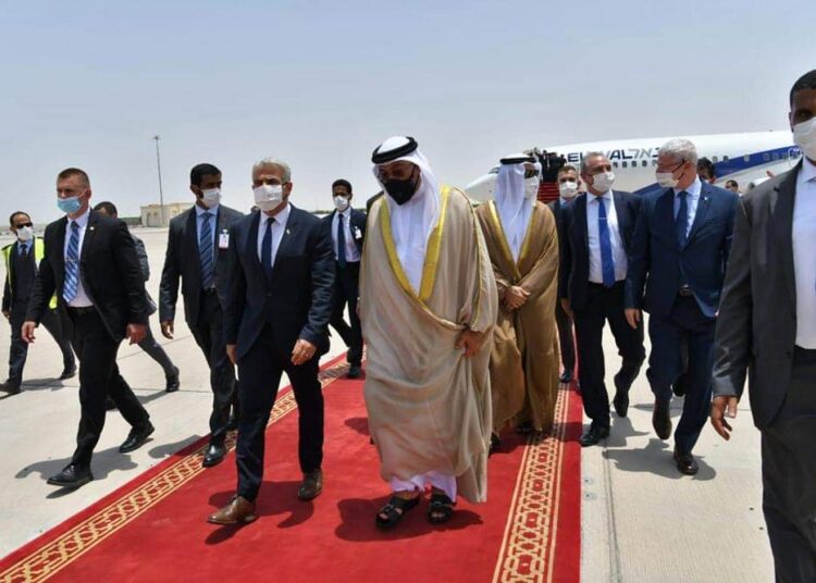 Israeli Foreign Minister Yair Lapid, center left, arrives in Abu Dhabi, United Arab Emirates, June 29, 2021.