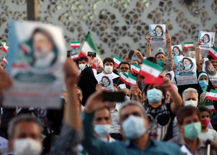Supporters of Ebrahim Raisi celebrate his presidential election victory in Tehran.