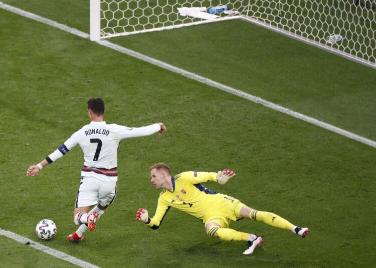 Euro 2020: Early reckoning for Belgium against holders Portugal 1 - Egyptian Gazette Portugal's Cristiano Ronaldo scores his side's third goal during the Euro 2020 group F match against Hungary in Budapest, Hungary, on June 15, 2021.