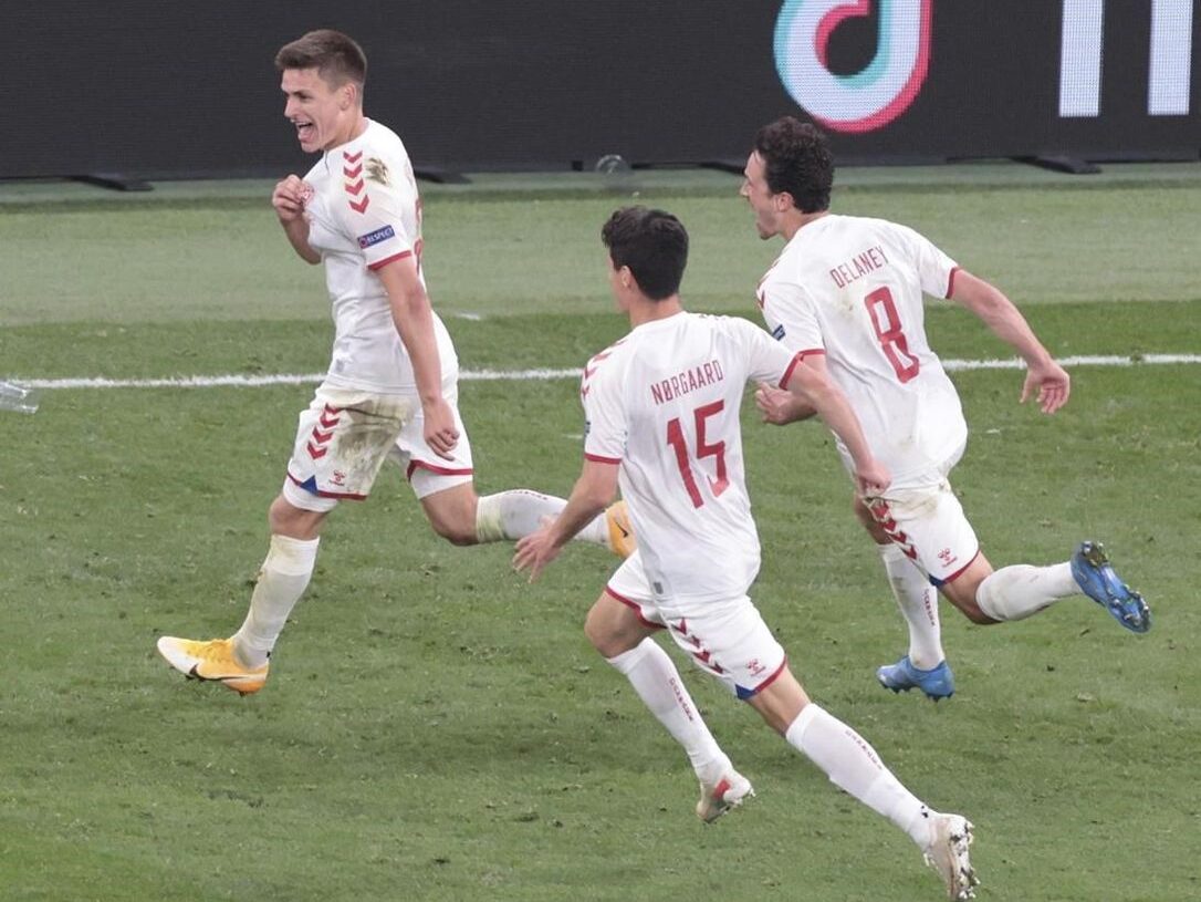 Denmark's Joakim Maehle (L) celebrates after scoring his side's fourth goal during their Euro 2020 group B match against Russia in Copenhagen.