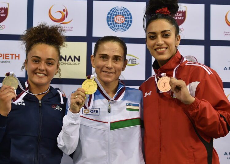 Egypt's Nancy grabs bronze at Artistic Gymnastics World Cup 1 - Egyptian Gazette From left: Coline Devillard of France, Oksana Chusovitina of Uzbekistan and Nancy Taman of Egypt posing with their medals at the 13th Artistic Gymnastics World Cup.