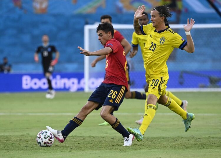 Spain's Pedri (L) challenges for the ball with Sweden's Kristoffer Olsson during their Euro 2020 championship group E match in Seville.