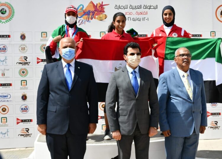 Youth and Sports Minister Ashraf Sobhy (C) posing for a group photo after the Egyptian shooters won the gold medal at the Arab Shooting Championship.