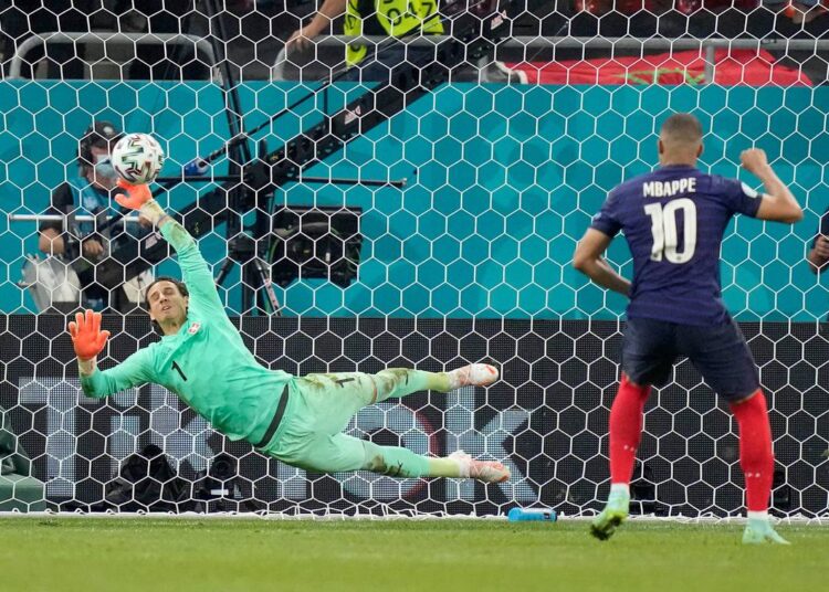 Switzerland's goalkeeper Yann Sommer saves the penalty shot by France's Kylian Mbappe during their Euro 2020 round of 16 clash in Bucharest.