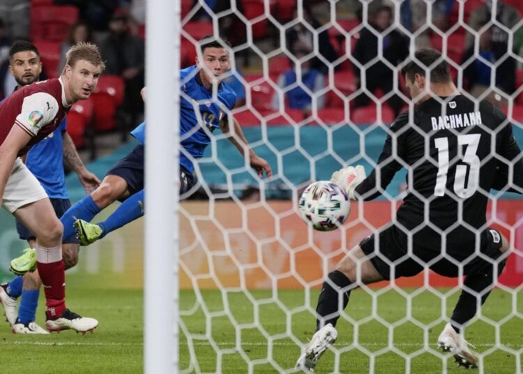 Italy's Matteo Pessina, third from left, scores his side's second goal during the Euro 2020 soccer championship round of 16 match between Italy and Austria at Wembley stadium in London.