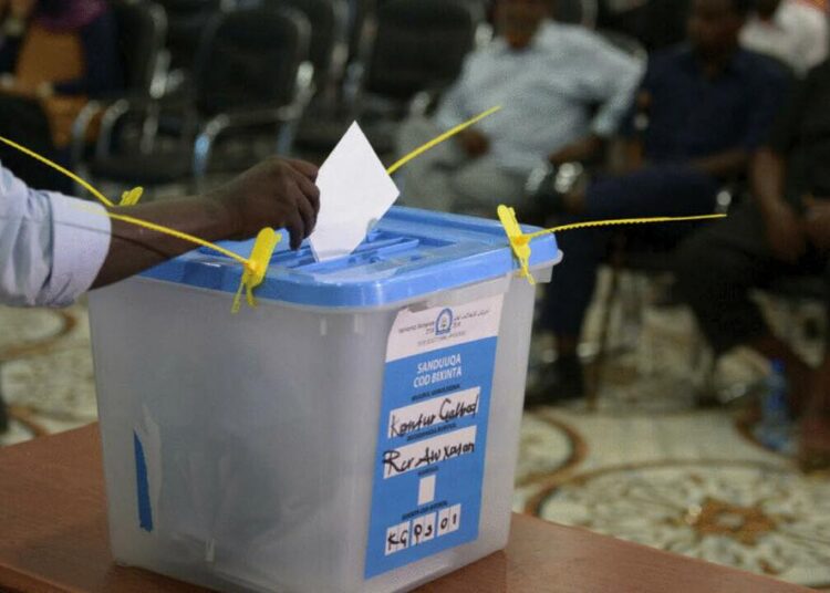 Somalia postpones start of parliamentary, presidential elections 1 - Egyptian Gazette A file photo of a person casting his ballot in Baidoa, southern Somalia.