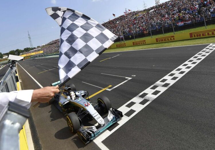 Mercedes AMG Petronas F1 Team's British driver Lewis Hamilton crosses the finish line to win the Formula One Hungarian Grand Prix at the Hungaroring circuit in Mogyorod near Budapest, Hungary, on July 24, 2016.   REUTERS/ANDREJ ISAKOVIC/Pool