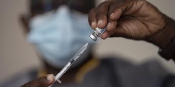 West African health officials race to vaccinate amid spikes
