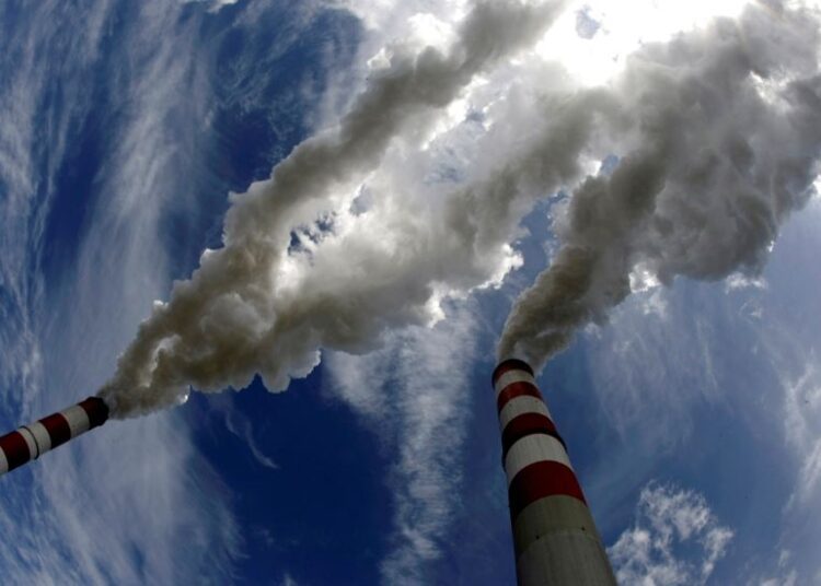 More countries hike climate pledges, piling pressure on major emitters 1 - Egyptian Gazette Smoke billows from the chimneys of the Belchatow coal-fired power station in this May 7, 2009, photo.