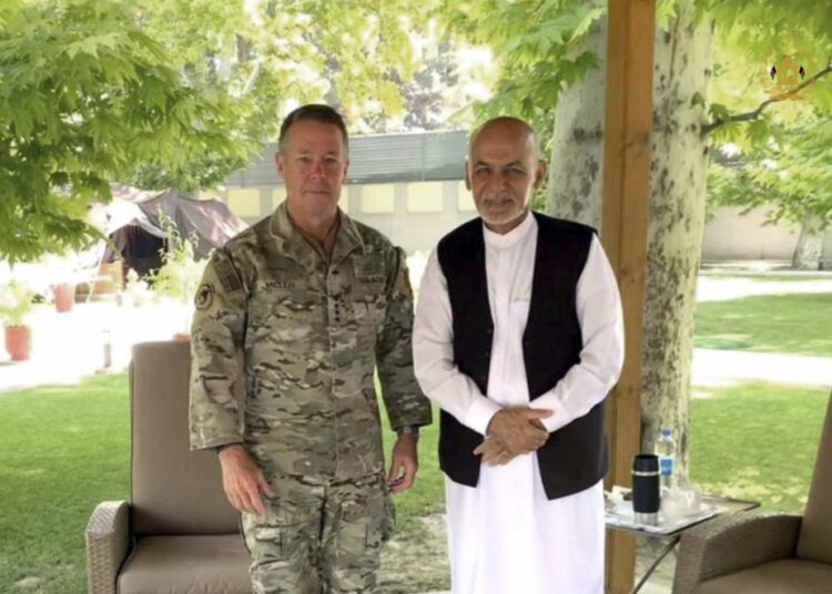 US Army Gen. Austin Miller, the US's top general in Afghanistan, meets Afghan President Ashraf Ghani at the presidential palace in Kabul on Friday.