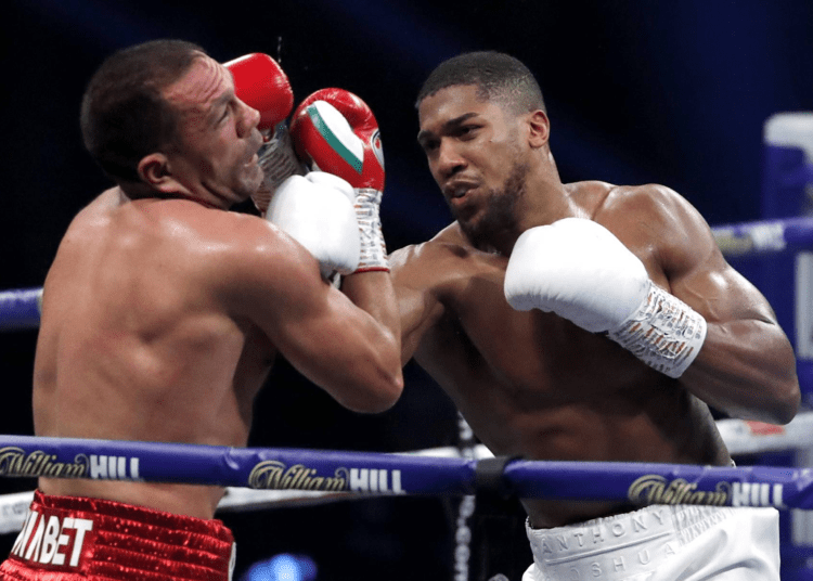 Joshua defending heavyweight titles vs Usyk in Sept. 1 - Egyptian Gazette Anthony Joshua (R) punches Kubrat Pulev during their heavyweight world title fight in London on Dec. 12, 2020.