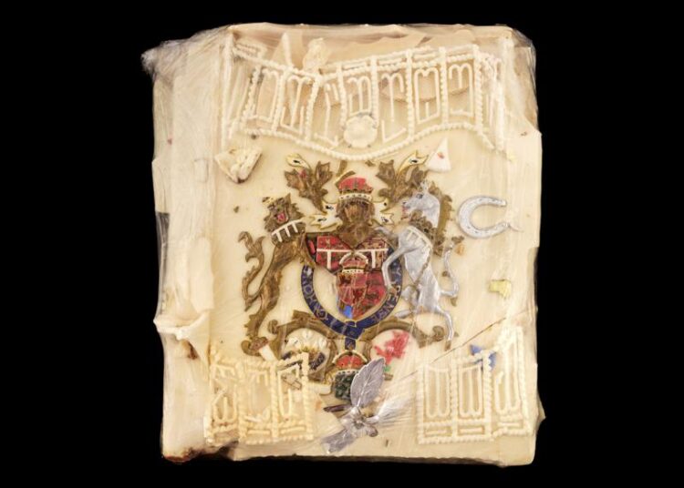 In this undated photo provided Wednesday July 28, 2021, by Dominic Winter Auctioneers, showing a slice of cake from one of the 23 official wedding cakes made for the Royal Wedding of Britain's Prince Charles and Lady Diana Spencer on Wednesday 29 July 1981, that is up for auction. The cake was given to Moyra Smith, a member of the Queen Mother's household at Clarence House, who preserved the topping with cling film, and will be auctioned Aug. 11.