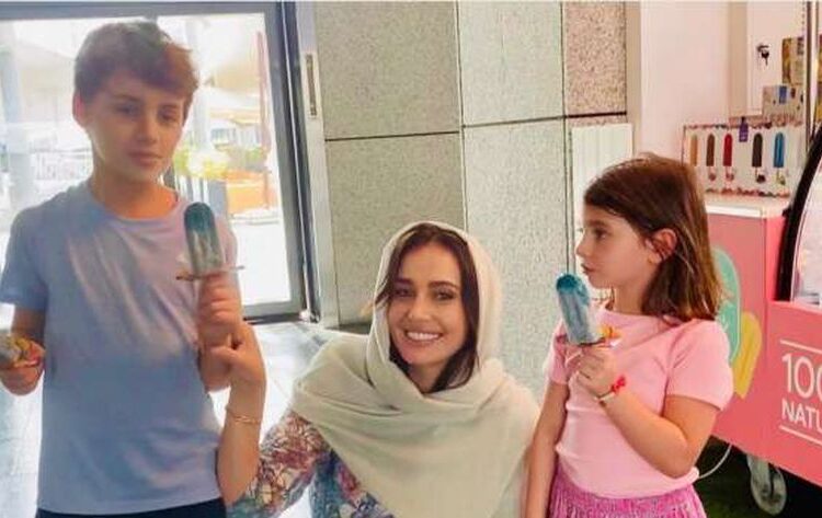 Retired actress Hala Shiha posing for a photo with her children.