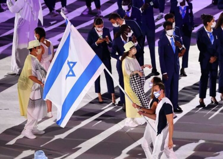 Tokyo 2020 Olympics - The Tokyo 2020 Olympics Opening Ceremony - Olympic Stadium, Tokyo, Japan - July 23, 2021. Hanna Knyazyeva-Minenko of Israel and Yakov Toumarkin of Israel during the opening ceremony