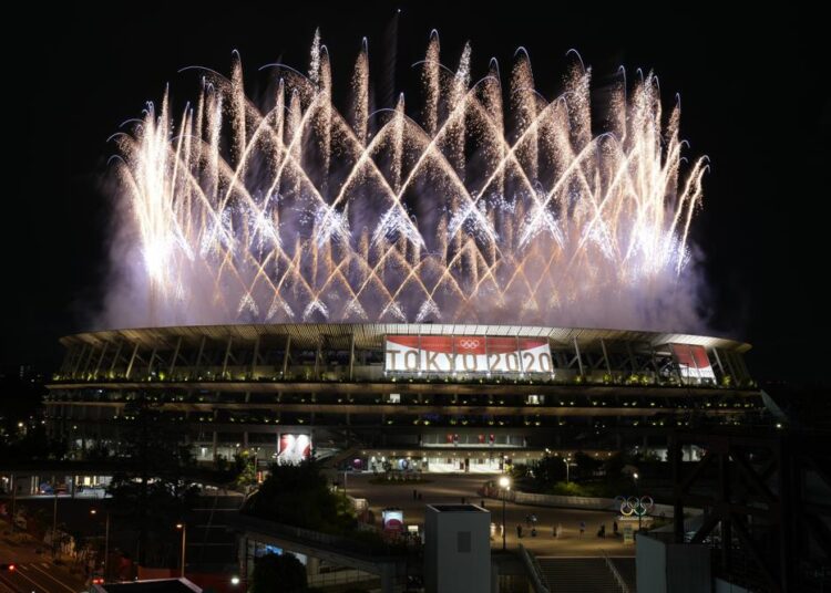 Fireworks illuminate over the National Stadium during the opening ceremony of the 2020 Summer Olympics.