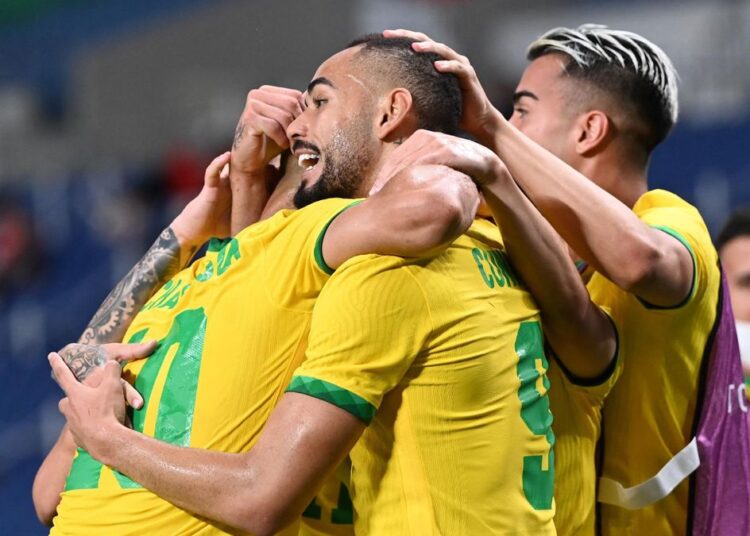 Brazil’s players celebrating after scoring against Egypt, thanks to a first-half strike from youngster Matheus Cunha at the Tokyo Olympics.