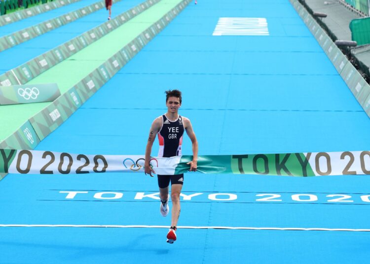 Olympics-Triathlon: Britain wins 1st-ever mixed-relay gold 1 - Egyptian Gazette Alex Yee of Britain celebrates after winning gold at the Tokyo Olympics.