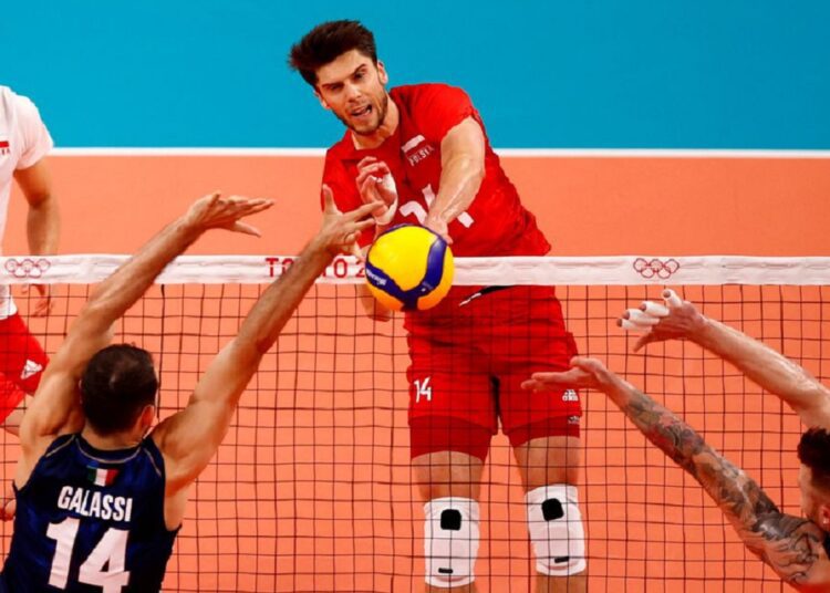 Aleksander Sliwka of Poland in action with Gianluca Galassi of Italy at the Tokyo Olympics.