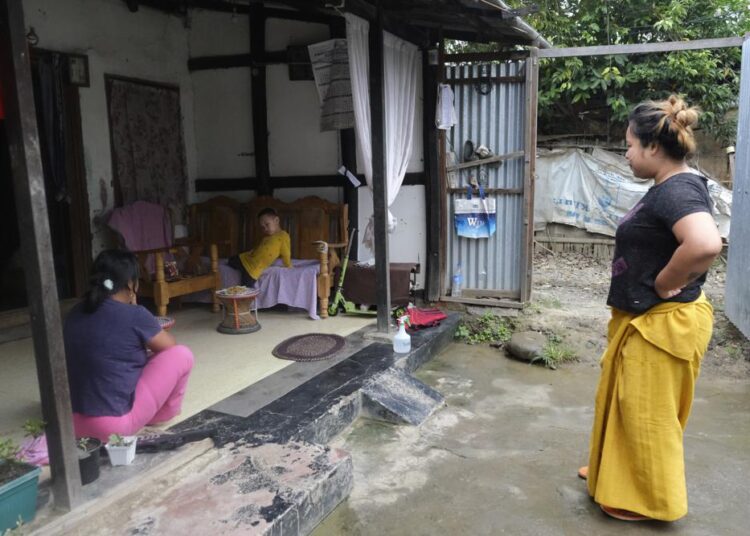 Pandemic leaves Indians mired in massive medical debts 1 - Egyptian Gazette Diana Khumanthem, 30, watches her three-year-old nephew Hridhaan, who she has decided to raise as her own after his mother Ranjita died of Covid-19, at home in Imphal, in Manipur, India.