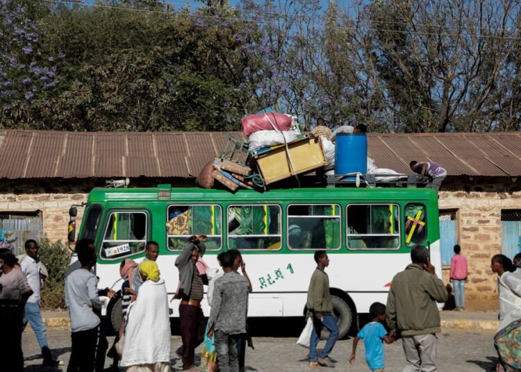 A bus carrying displaced people arrives at the Tsehaye primary school, which was turned into a temporary shelter for people displaced by conflict, in the town of Shire, Tigray region, Ethiopia, March 14, 2021.