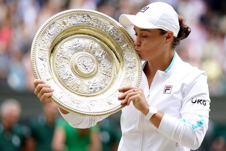 Australia's Ashleigh Barty poses with the trophy after winning the women's singles final of the Wimbledon Championships in London.