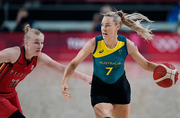 Olympics-Basketball: Belgium women beat Australia 85-70 1 - Egyptian Gazette Australia's Tess Madgen (7) drives up court past Belgium's Hanne Mestdagh (22) during a women's basketball preliminary round game at the 2020 Summer Olympics, Tuesday, July 27, 2021, in Saitama, Japan.