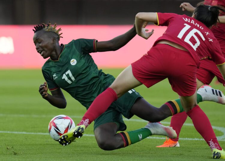 Zambia's Racheal Kundananji (17) collides with China's Wang Xiaoxue (16) during a women's soccer match at the 2020 Summer Olympics, Saturday, July 24, 2021, in Miyagi, Japan.