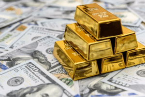 Gold drops to near 2-week low as stocks and dollar rise 2 - Egyptian Gazette