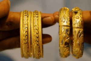 Gold drops to near 2-week low as stocks and dollar rise 4 - Egyptian Gazette