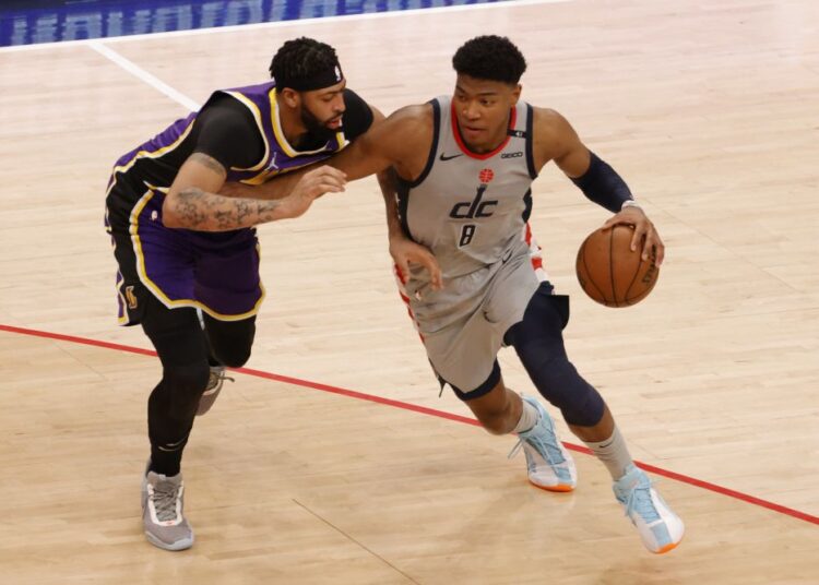 Washington Wizards forward Rui Hachimura (8) drives to the basket as Los Angeles Lakers forward Anthony Davis (3) defends in the second quarter at Capital One Arena April 28, 2021.