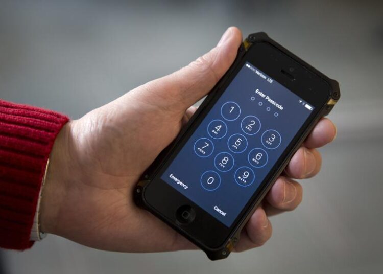 In this Feb. 17, 2016, file photo an iPhone is seen in Washington. At a time of widespread digital insecurity it turns out that the oldest and simplest computer fix there is — turning a device off then back on again — can thwart hackers from stealing information from smartphones.