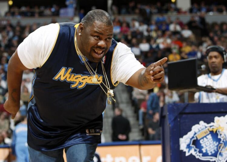 Biz Markie performs for fans during halftime of the Denver Nuggets' 105-99 victory over the Phoenix Suns in an NBA basketball game in Denver on Dec. 12, 2009. The hip-hop staple known for his beatboxing prowess, turntable mastery and the 1989 classic “Just a Friend,” has died. He was 57.