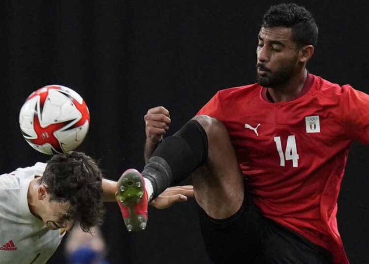 Spain centre-back Pau Torres (L) fights for the ball against Egypt’s striker Ahmed Yasser during their Men's First Round Group C match at the Tokyo 2020 Olympic Games.