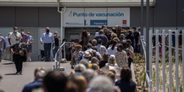Spaniards put faith in COVID-19 vaccines even as cases surge
