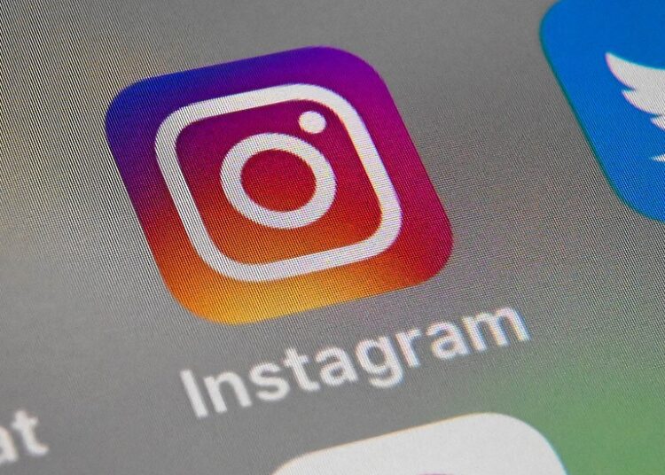 A picture taken on October 1, 2019 in Lille shows the logo of mobile app Instagram displayed on a tablet. (Photo by DENIS CHARLET / AFP)