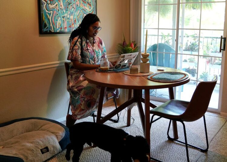 Capitalising on remote work, US cities draw in tech workers 1 - Egyptian Gazette Jaleesa Garland, a marketing manager at an e-commerce startup, works in her apartment in Tulsa.