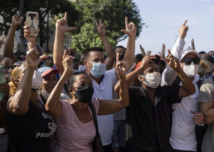 Anti-government protesters march in Havana, Cuba, Sunday, July 11, 2021. As Cubans facing the country's worst economic crisis in decades took to the streets in droves over the weekend into Monday, July 12, 2021, authorities blocked social media sites in an apparent effort to stop the flow of information into, out of and within the beleaguered nation.