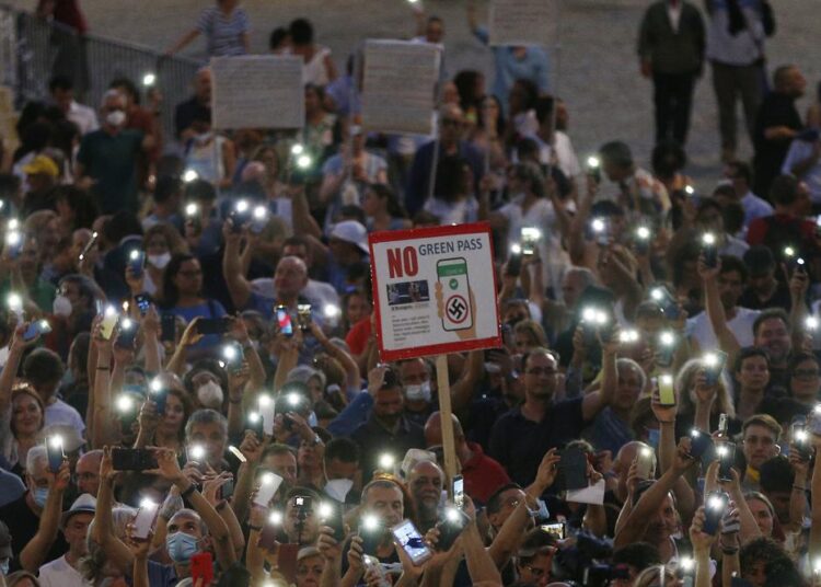 Europe’s vaccine passes reveal some pockets of resistance 1 - Egyptian Gazette People stage a protest against the Covid-19 vaccination pass in Rome.