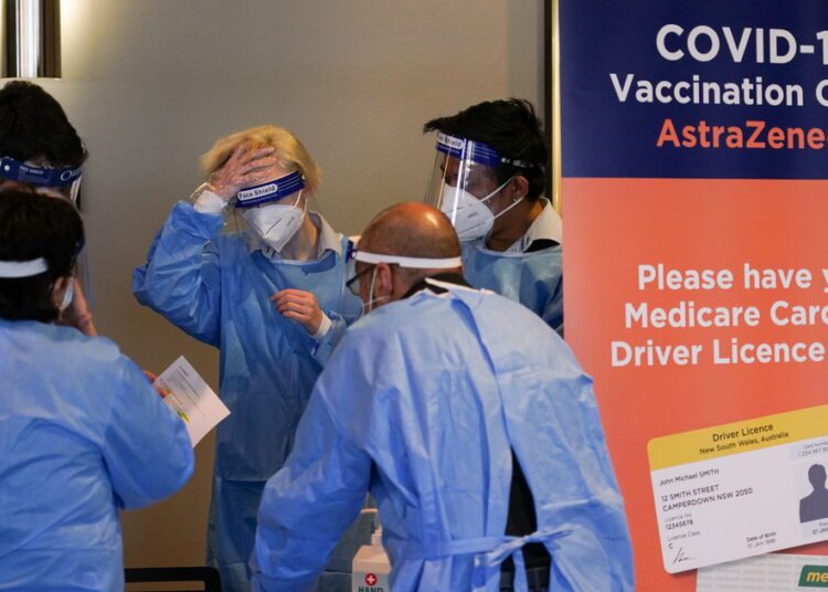 Medical staff work in the waiting area at a coronavirus disease (COVID-19) vaccination clinic at the Bankstown Sports Club as the city experiences an extended lockdown, in Sydney, Australia, August 3, 2021.