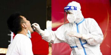 China orders mass testing in Wuhan as Covid outbreak spreads