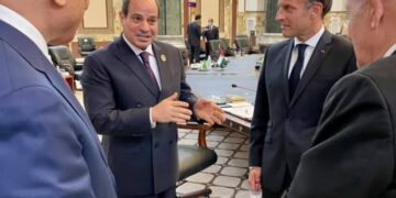 President Sisi (L) talking to French President Macron on the sidelines of the Baghdad summit on Saturday.