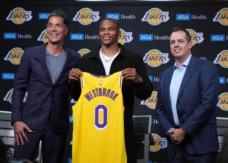 Aug 10, 2021; Los Angeles, California, USA; Los Angeles Lakers general manager Rob Pelinka (left), Russell Westbrook (center) and coach Frank Vogel pose at press conference at Staples Center. Mandatory Credit: Kirby Lee-USA TODAY Sports